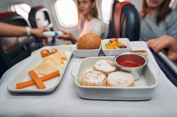 Delicious food standing on airline meal trolley