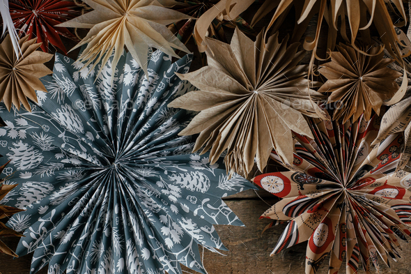 Christmas stars rustic flat lay. Beautiful paper stars made from christmas wrapping paper