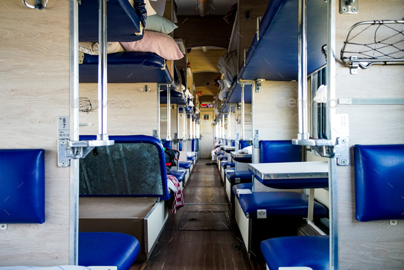 Interior of a typical russian long-distance RZD train with beds for ...