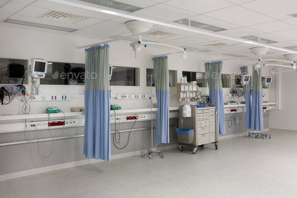 Recovery room in a modern hospital, post-operative recovery, patient bays with curtains