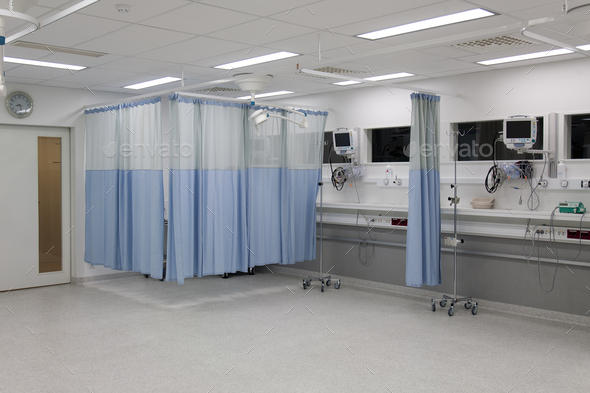 Recovery room in a modern hospital, post-operative recovery, patient bays with curtains