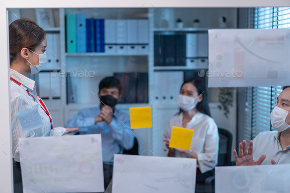 Group of Asian businessman and woman people wear mask, meeting in office.