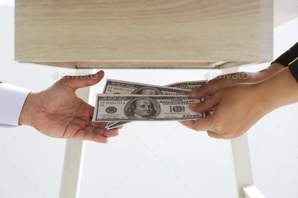 Handover money under the table Stock Photo by Garakta-Studio | PhotoDune