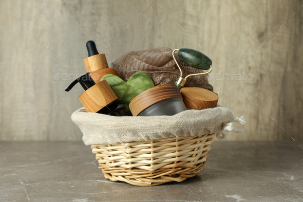 Gift basket with cosmetics on textured table