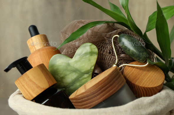 Concept of gift with basket of cosmetics, close up