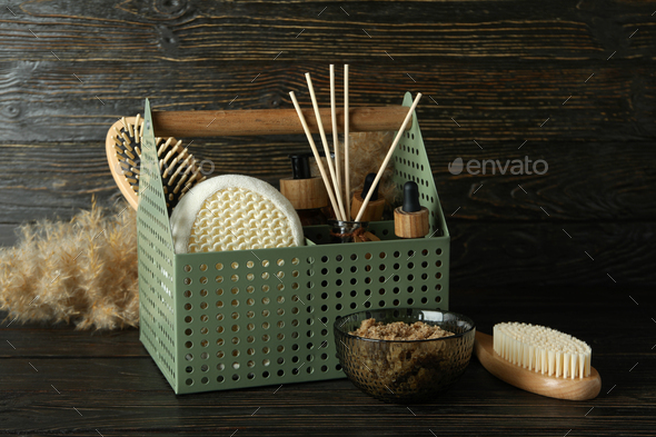 Concept of gift with basket of cosmetics on wooden table