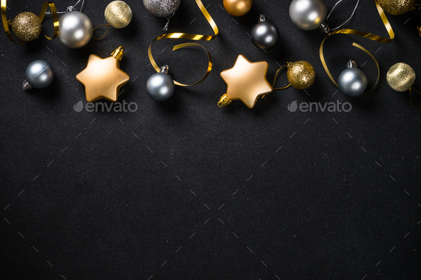 Christmas background with gold and silver decorations on black Stock Photo  by Nadianb