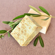 Handmade soap bars and olive branches on fabric background - PhotoDune Item for Sale