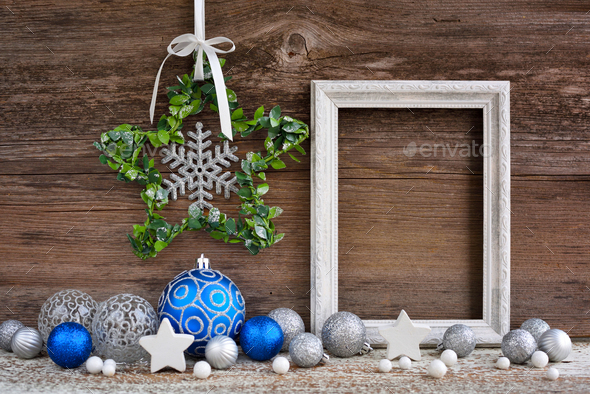 Christmas star with photo frame and festive decorations on a wooden background - Stock Photo - Images