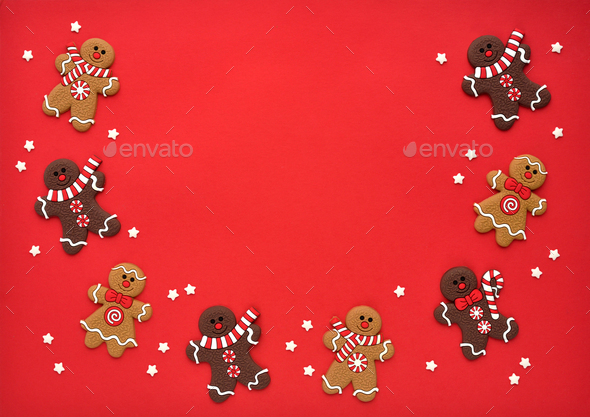 Christmas gingerbreads with stars оn red background. Christmas or New Year greeting card. - Stock Photo - Images