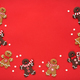 Christmas gingerbreads with stars оn red background. Christmas or New Year greeting card. - PhotoDune Item for Sale