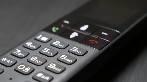 Modern keyboard of cordless phone hi-tech design in office 4K 2160p 30fps UltraHD footage - Portable alt