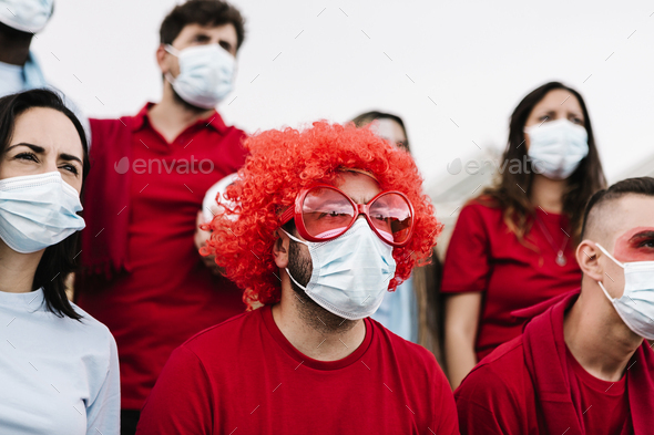 Group of football team supporters in face mask