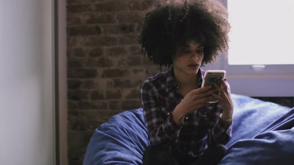 Afro American Female with smart phone