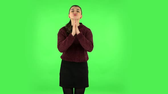 Girl Keeps Palm Together and Asks for Something. Green Screen alt