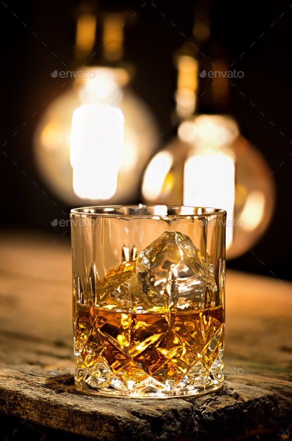 Whiskey with ice cubes Stock Photo by Givaga