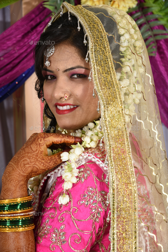 Indian bride wearing traditional wedding cloths in marriage ceremony ...