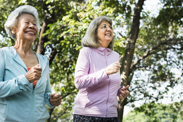 Senior friends exercising outdoors - Stock Photo - Images
