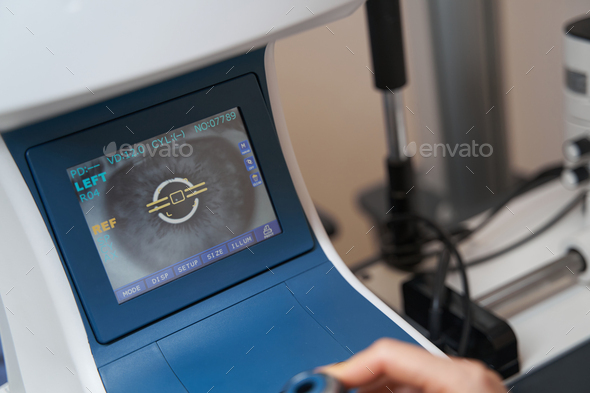 Image of an eye retina on screen of autorefractor - Stock Photo - Images