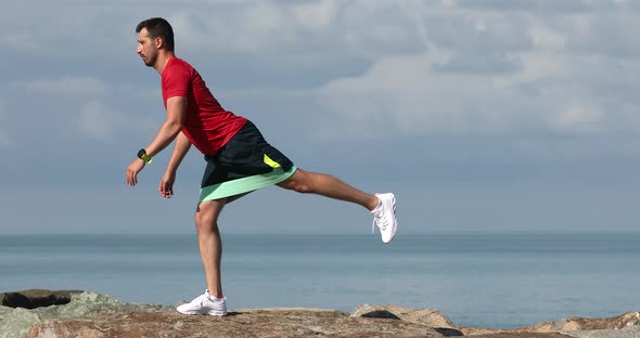 Young strong sporty athletic fit sportsman man in sports clothes warm up training.