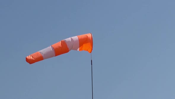 The Aerodrome Cone-wind Indicator Flutters Against the Blue Sky