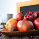 still life with red granates, pomegranates on wooden plate - PhotoDune Item for Sale