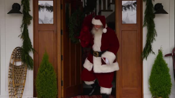 Santa Claus coming out of house, Stock Footage | VideoHive