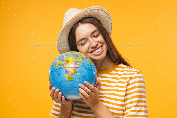 Planet care, save the earth concept, cheerful young woman hugging globe