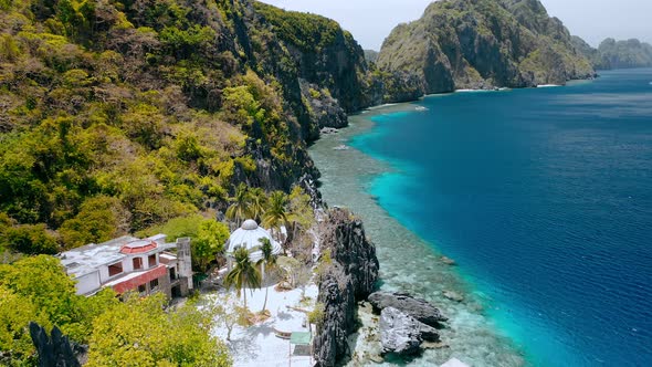 Aerial Fly Over Matinloc Shrine Along the Coastline alt