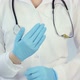 Hospital employee wearing medical gloves, making funny scary gestures, joking - VideoHive Item for Sale