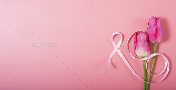 Red tulips and pink ribbon on pink background as breast cancer awareness  symbols Stock Photo by DmytroMykhailov