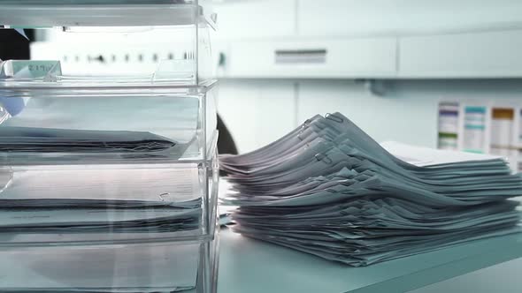 Unsolved Papers in a Stack on the Desk