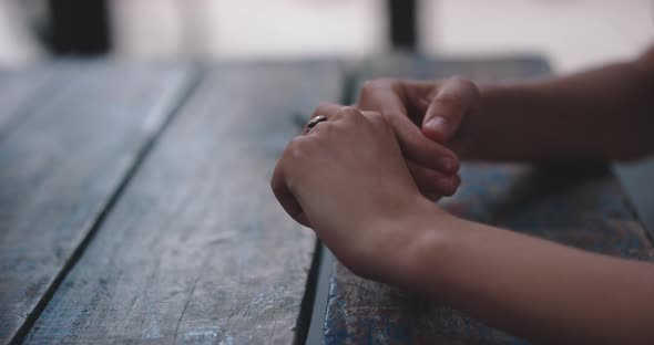 Food Date 008Woman plays with hands nervously while on date alt