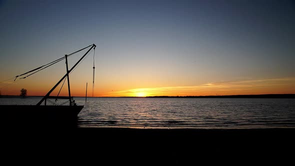 Time lapse of a Beautiful Sunset, with a Silhouette of a Boat at Britannia Beach, Ottawa alt