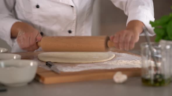 Detail Rolling Out Dough for Pizza