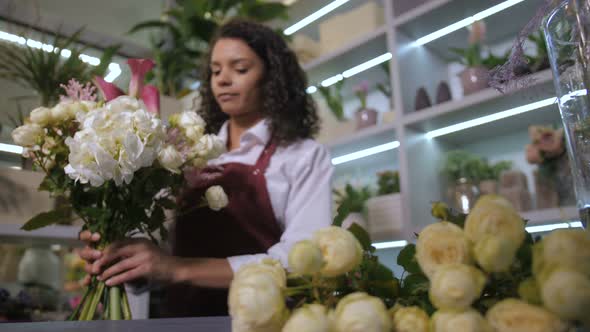 Young Florist Making Beautiful Flower Arrangement alt