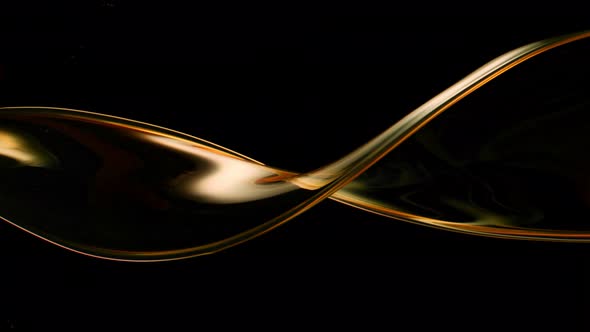 Super Slow Motion Shot of Swirling and Splashing Golden Oil Isolated on Black Background at 1000Fps alt