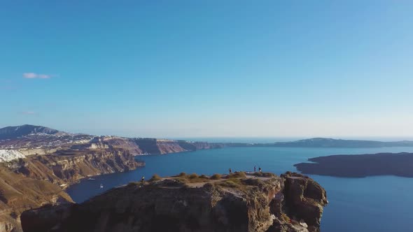 4k Aerial drone footage flying over Skaros rock Caldera Santorini Greece alt
