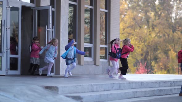 Cheerful Elementary Age Pupils Leaving School alt