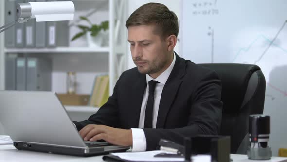 Male Employee Feeling Wrist Pain After Typing on Laptop, Inflammation of Joint