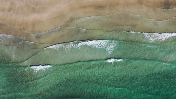 Top down view on the Norway beach and sea waves