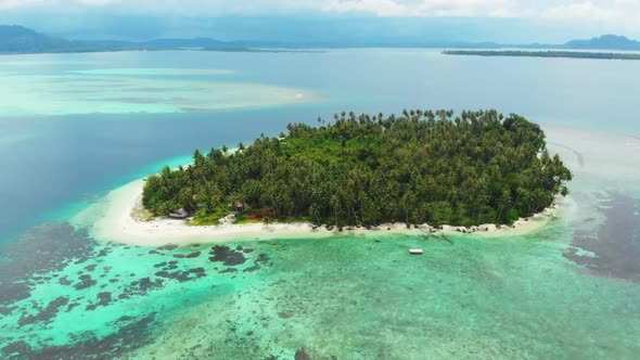 Aerial: flying over tropical island white beach caribbean sea turquoise water alt
