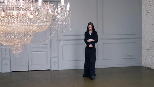 Sexy Lady in Black Dress is Posing in Light Room Dramatic and Mysterious Mood alt