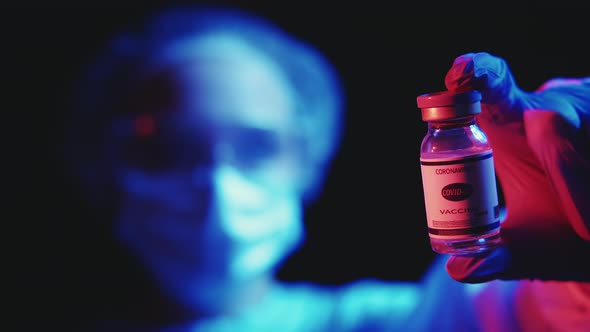 Vaccine Development Covid19 Vial in Doctor Hand alt