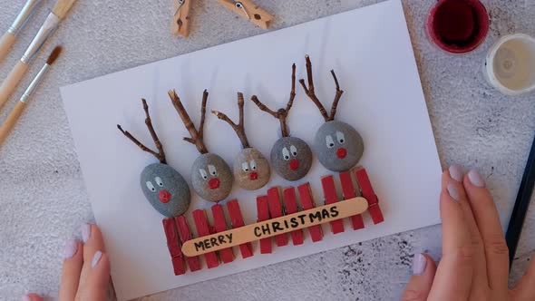 Making Diy Merry Christmas Deer on Greeting Card Postcard Made of Pebbles Sea Stones Clothespins and alt