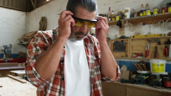 Carpenter putting his equipment alt