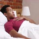 Coughing Sick African Man Lying in Bed at Night - VideoHive Item for Sale