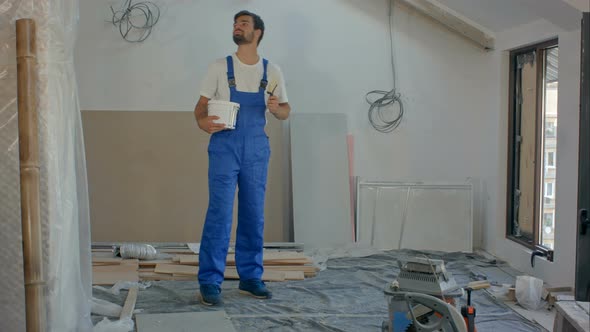 Man As Construction Worker Building House and Carrying Wood alt