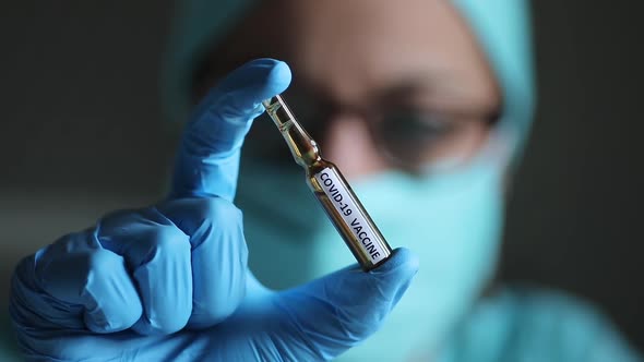 Doctor holding a recipient with the coronavirus COVID-19 vaccine