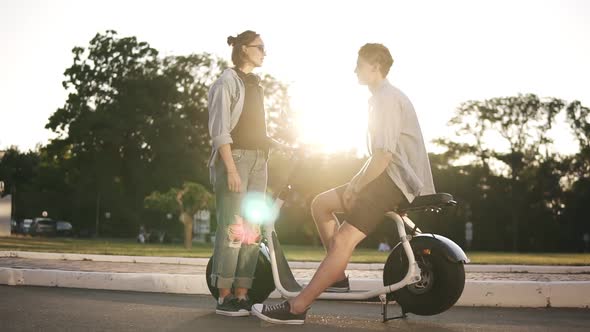 Young Male and Female are Have Time Together Outdoors alt